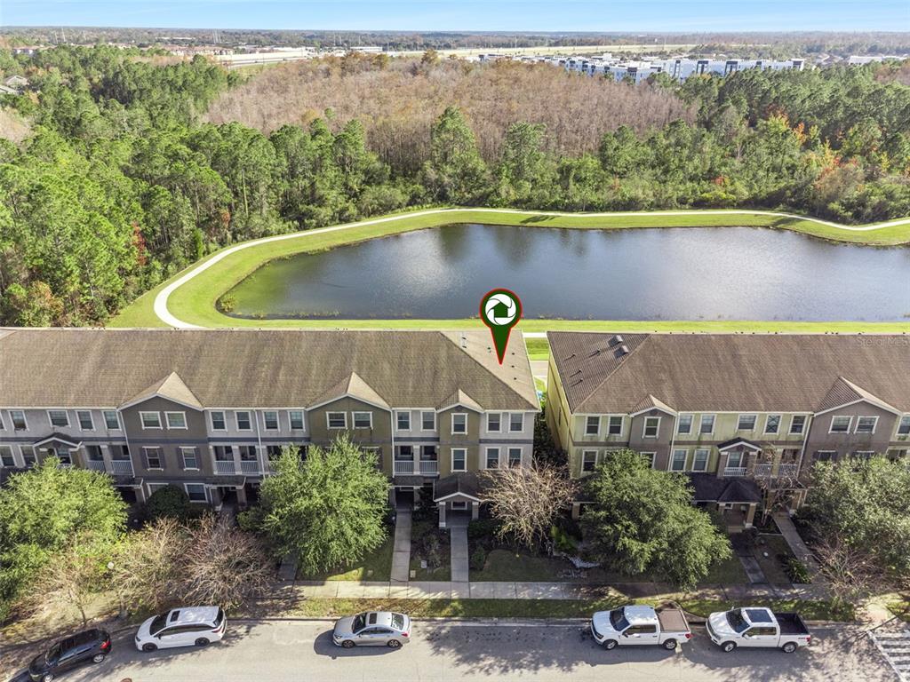 10866 Sunset Ridge Lane Orlando, FL 32832 - Photo 11 of 74 an aerial view of a house with a yard lake and mountain view