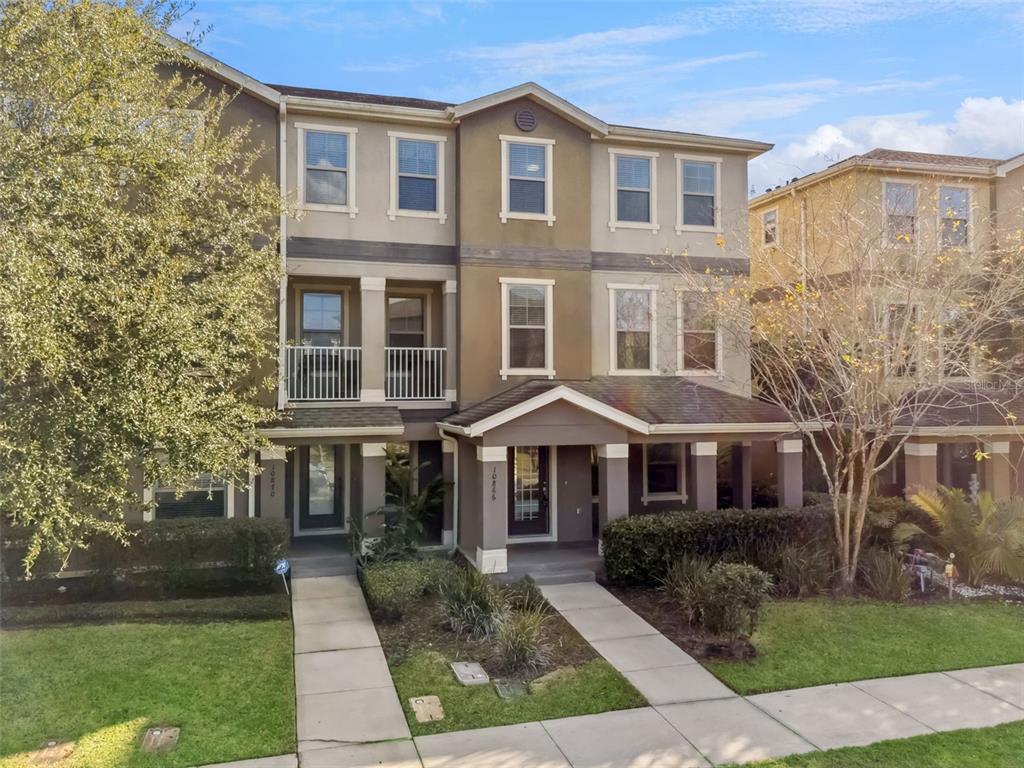 10866 Sunset Ridge Lane Orlando, FL 32832 - Photo 14 of 74 a front view of a house with a yard