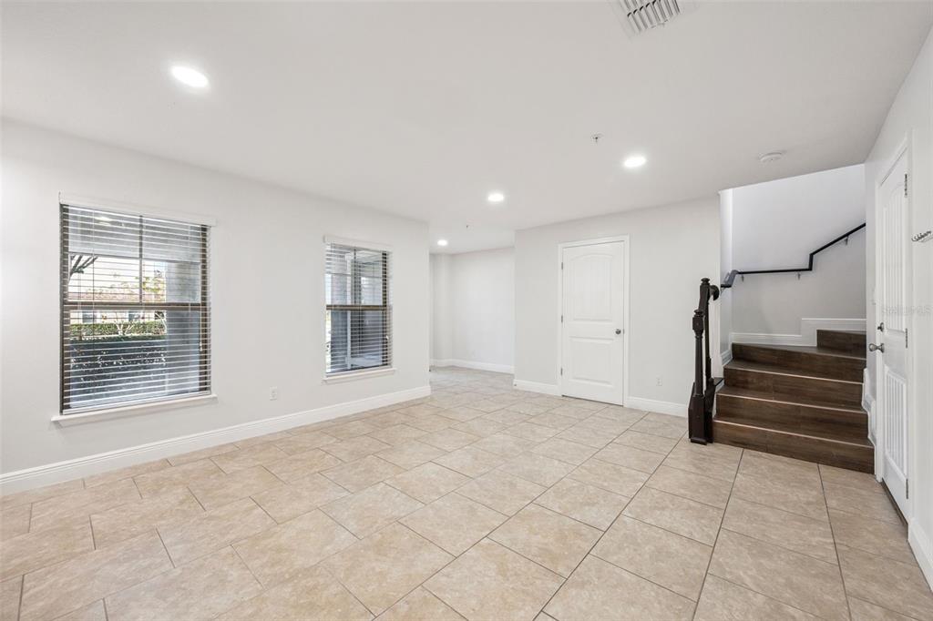 10866 Sunset Ridge Lane Orlando, FL 32832 - Photo 28 of 74 a view of an empty room with a fireplace and a window