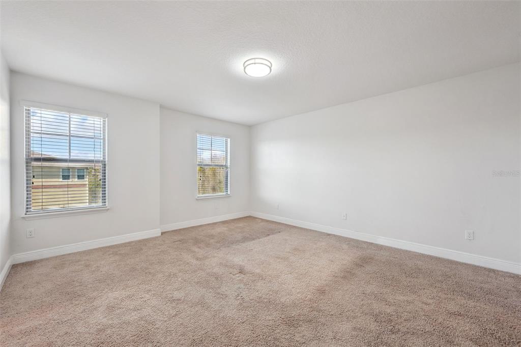 10866 Sunset Ridge Lane Orlando, FL 32832 - Photo 35 of 74 an empty room with windows