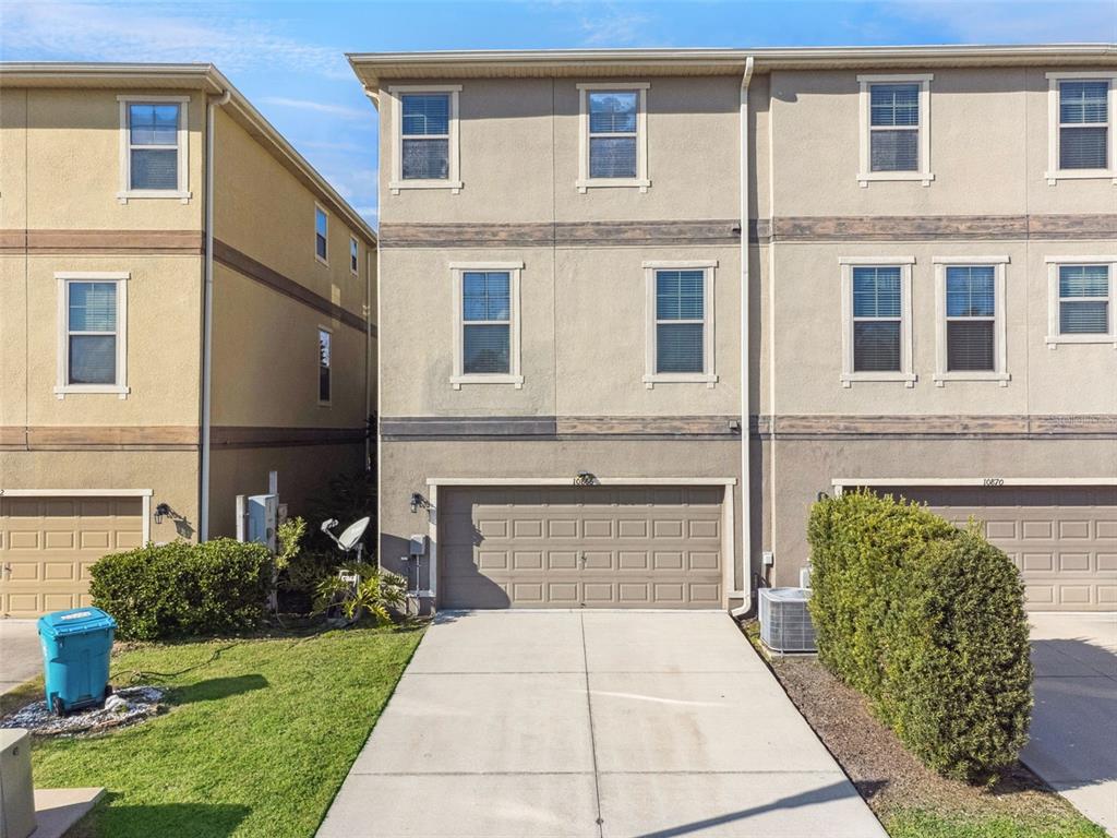 10866 Sunset Ridge Lane Orlando, FL 32832 - Photo 43 of 74 a front view of a house with garden