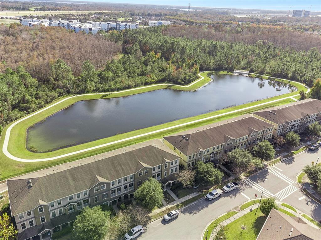 10866 Sunset Ridge Lane Orlando, FL 32832 - Photo 47 of 74 a view of a swimming pool with a balcony