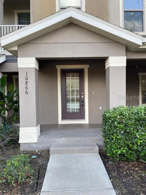 10866 Sunset Ridge Lane Orlando, FL 32832 - Photo 56 of 74 a front view of a house with garden