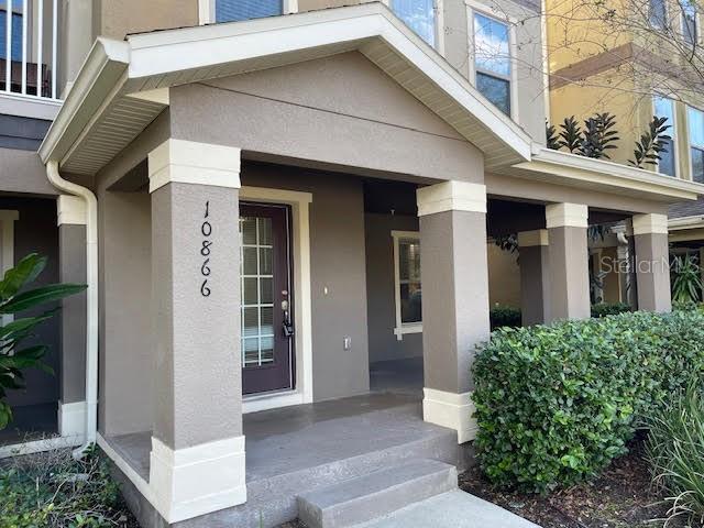 10866 Sunset Ridge Lane Orlando, FL 32832 - Photo 57 of 74 a view of a house with a small porch