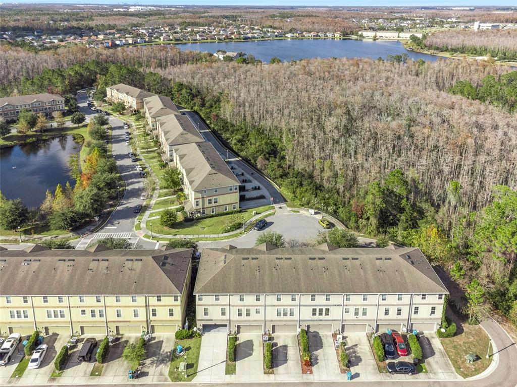 10866 Sunset Ridge Lane Orlando, FL 32832 - Photo 7 of 74 a view of a lake with a city