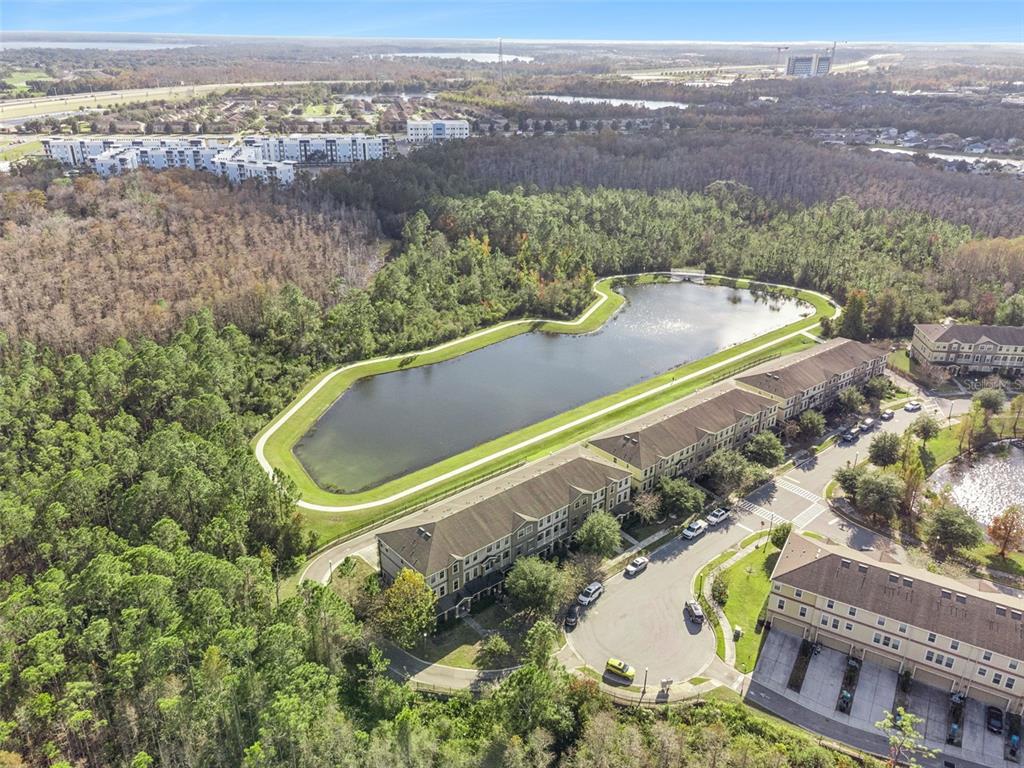 10866 Sunset Ridge Lane Orlando, FL 32832 - Photo 8 of 74 an aerial view of a house with a swimming pool