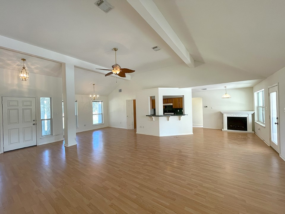 1111 Pine Ranch Road Seguin, TX 78155 - Photo 21 of 50 View of entry, dining room, kitchen from family room. 2 bedrooms and bath are down hall behind kitchen.