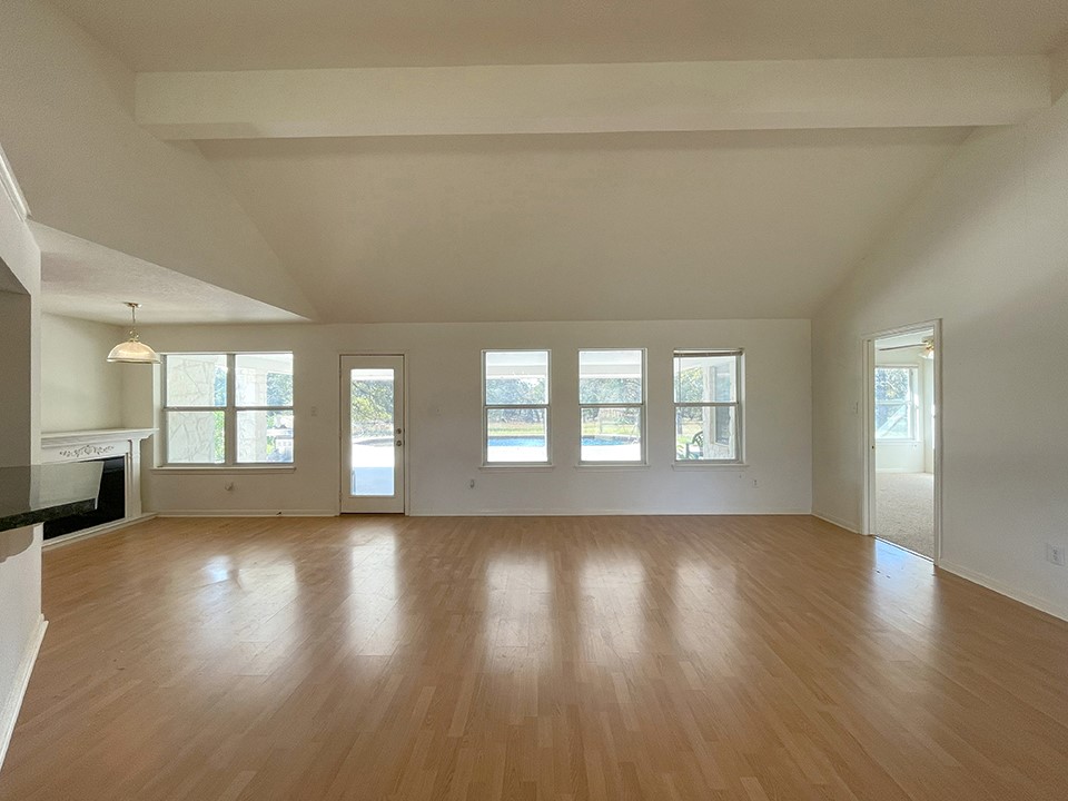 1111 Pine Ranch Road Seguin, TX 78155 - Photo 22 of 50 Main house rear entry family room. View of pool from windows. Master bdrm is on right. Breakfast nook is on left.