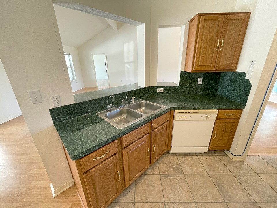 1111 Pine Ranch Road Seguin, TX 78155 - Photo 26 of 50 Kitchen has stainless sinks and dishwasher.