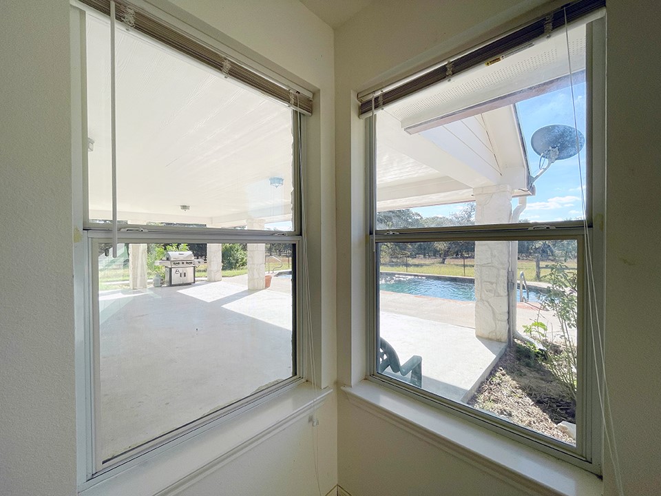 1111 Pine Ranch Road Seguin, TX 78155 - Photo 29 of 50 View from primary bedroom of verandah and pool.