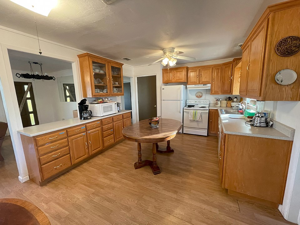 1111 Pine Ranch Road Seguin, TX 78155 - Photo 38 of 50 Guest house has large kitchen 13'x11' with laminate floor, formica counters, electric oven, dishwasher.