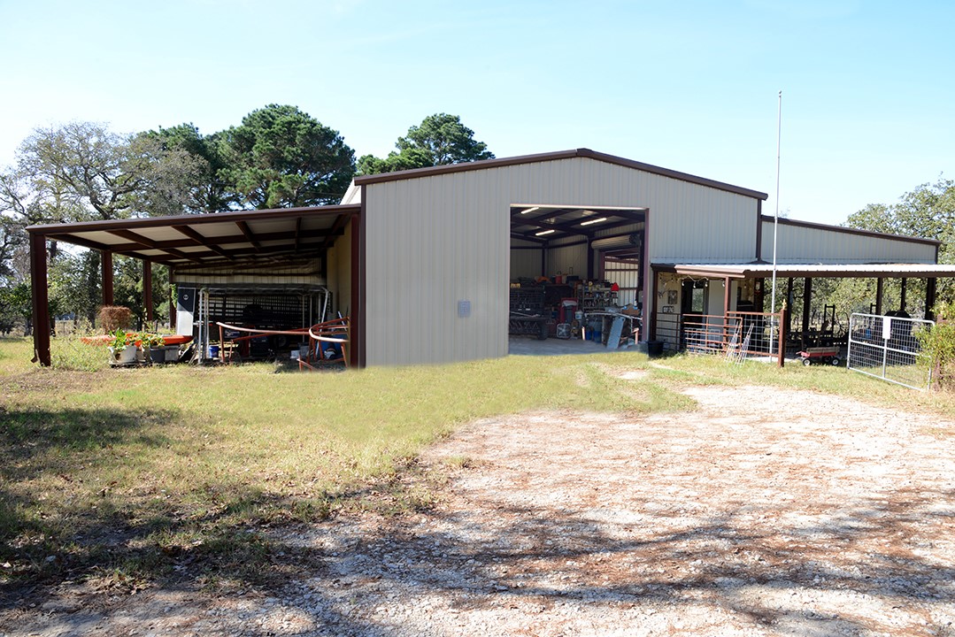 1111 Pine Ranch Road Seguin, TX 78155 - Photo 44 of 50 Barn 60'x40' enclosed w/ covered tractor/equipment storage