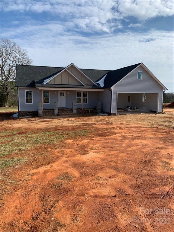 1283 George Brown Road Crouse, NC 28033 - Photo 1 of 4 a front view of a house with a yard