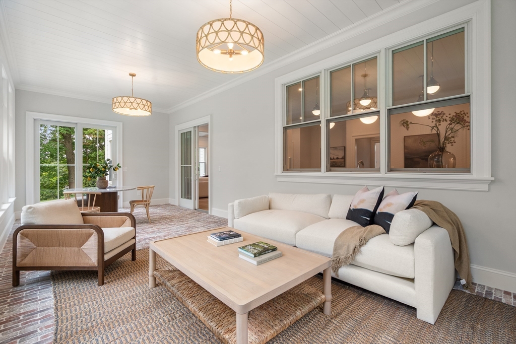 15 Lathrop Road Wellesley, MA 02482 - Photo 14 of 40 a living room with furniture a chandelier and a window