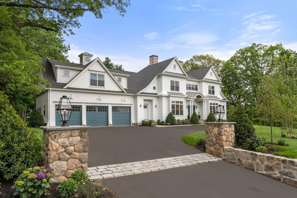 15 Lathrop Road Wellesley, MA 02482 - Photo 2 of 40 a front view of a house with a garden