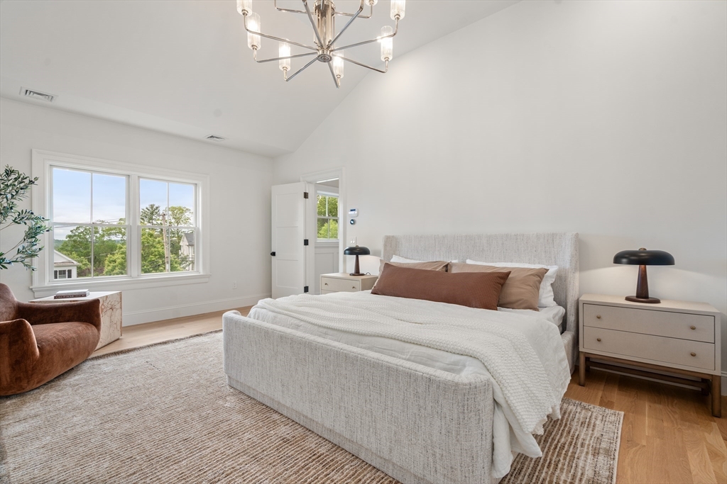 15 Lathrop Road Wellesley, MA 02482 - Photo 22 of 40 a bedroom with a large bed and a window