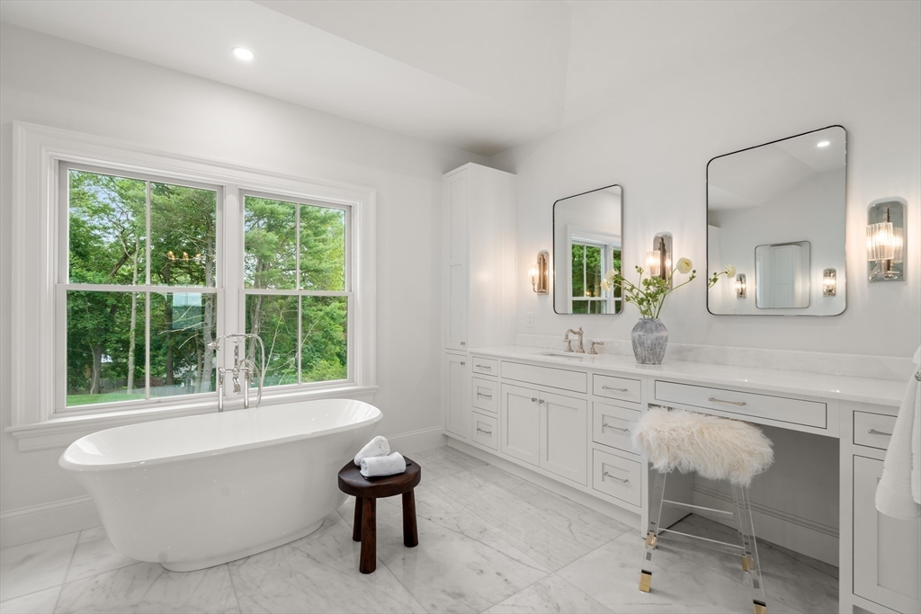 15 Lathrop Road Wellesley, MA 02482 - Photo 24 of 40 a spacious bathroom with a sink and a mirror