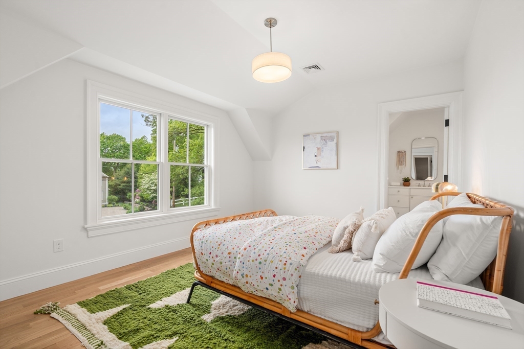 15 Lathrop Road Wellesley, MA 02482 - Photo 29 of 40 a bedroom with a bed and a window