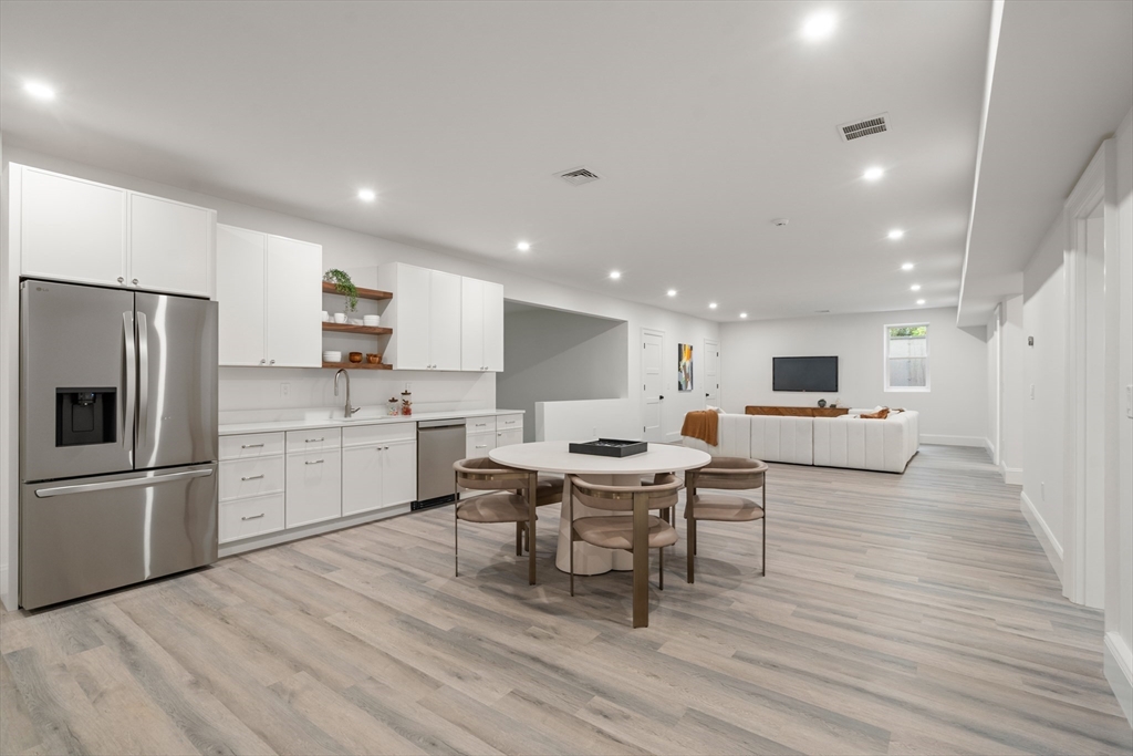 15 Lathrop Road Wellesley, MA 02482 - Photo 37 of 40 a living room with stainless steel appliances furniture and a kitchen view