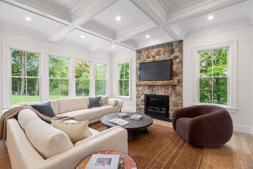 15 Lathrop Road Wellesley, MA 02482 - Photo 10 of 40 a living room with furniture and a fireplace