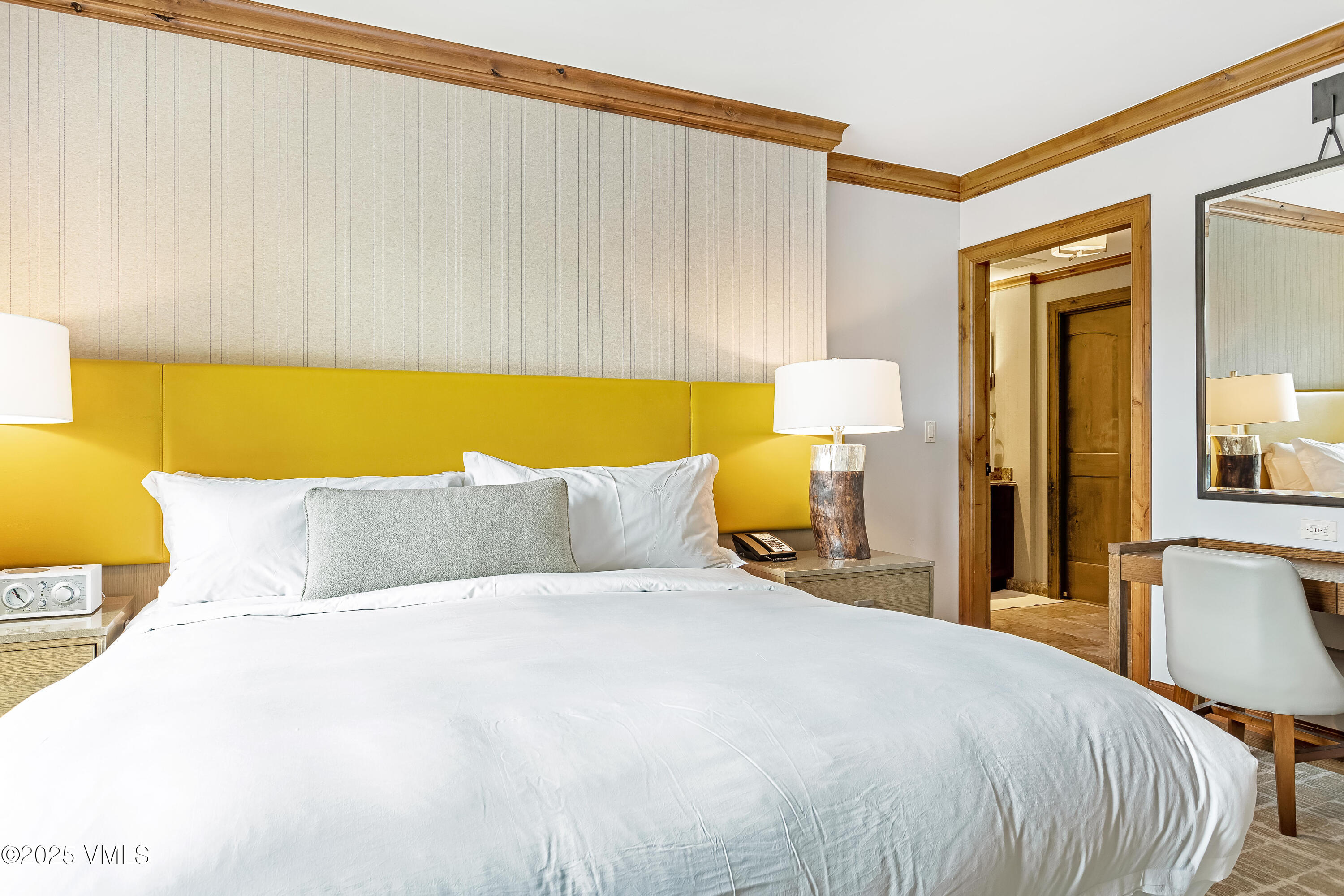 728 West Lionshead Circle, Unit F429 Vail, CO 81657 - Photo 11 of 25 a bedroom with a bed and a night stand