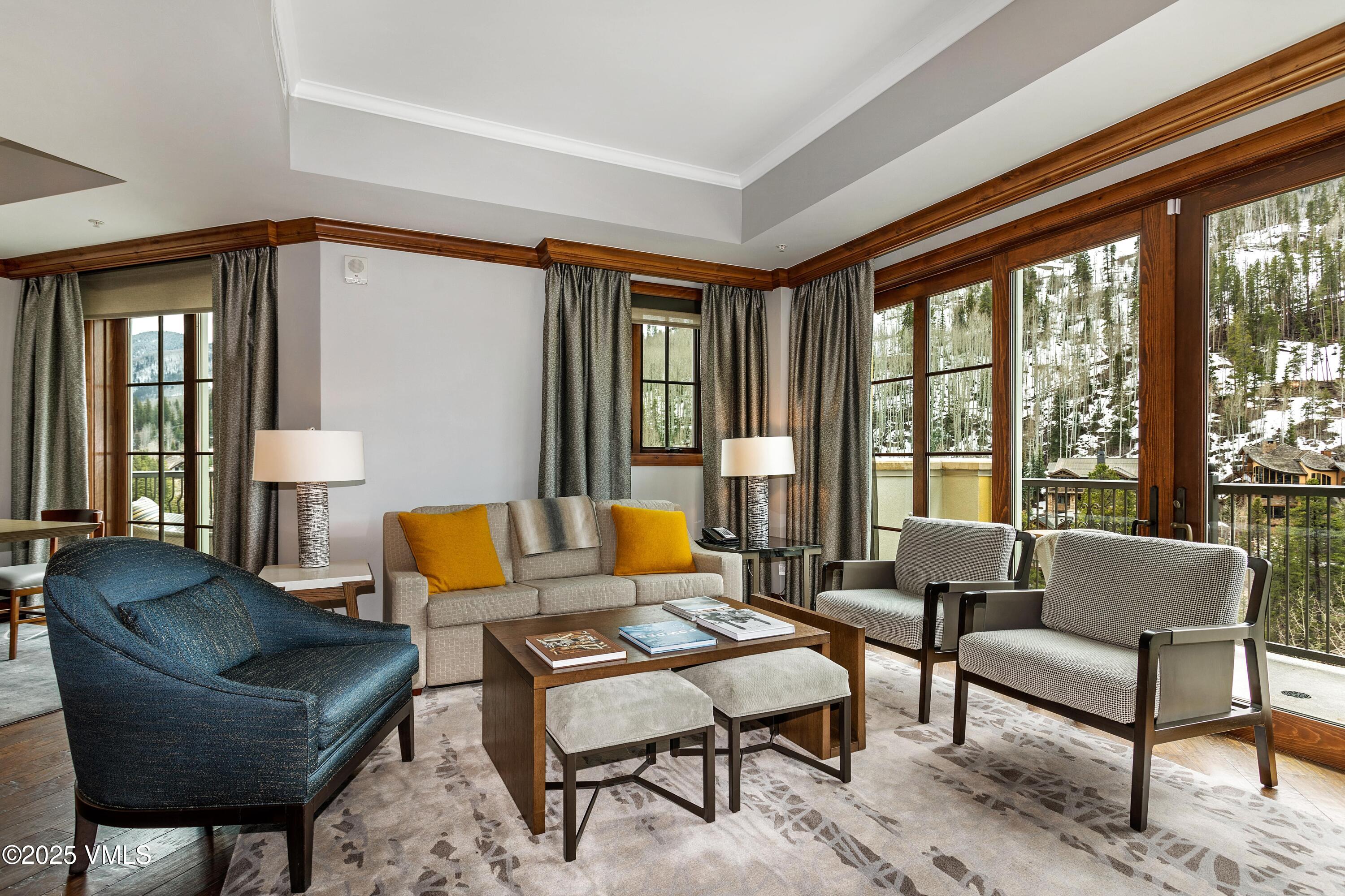 728 West Lionshead Circle, Unit F429 Vail, CO 81657 - Photo 20 of 25 a living room with furniture and a large window