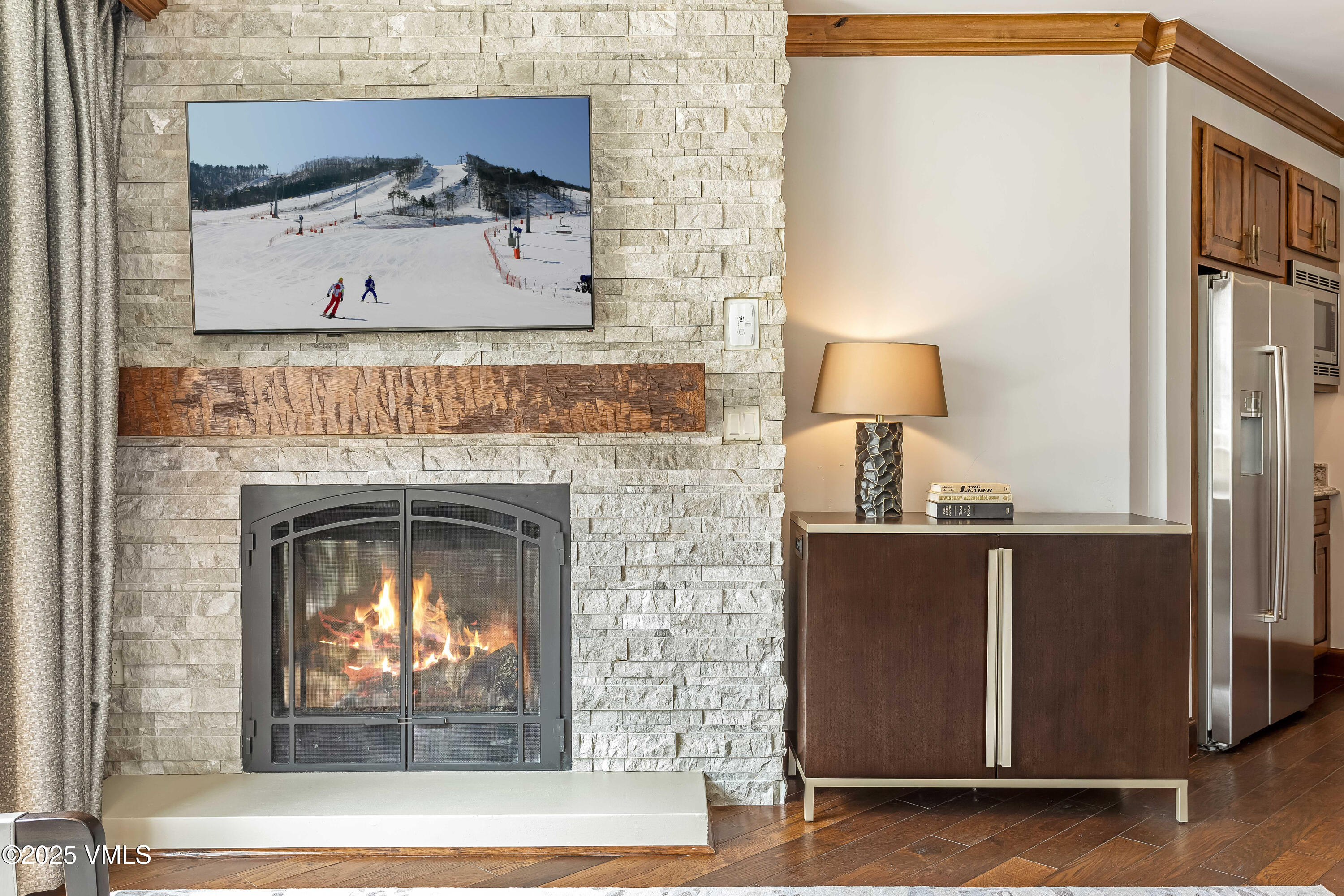 728 West Lionshead Circle, Unit F429 Vail, CO 81657 - Photo 23 of 25 a view of a fireplace with a wooden floor