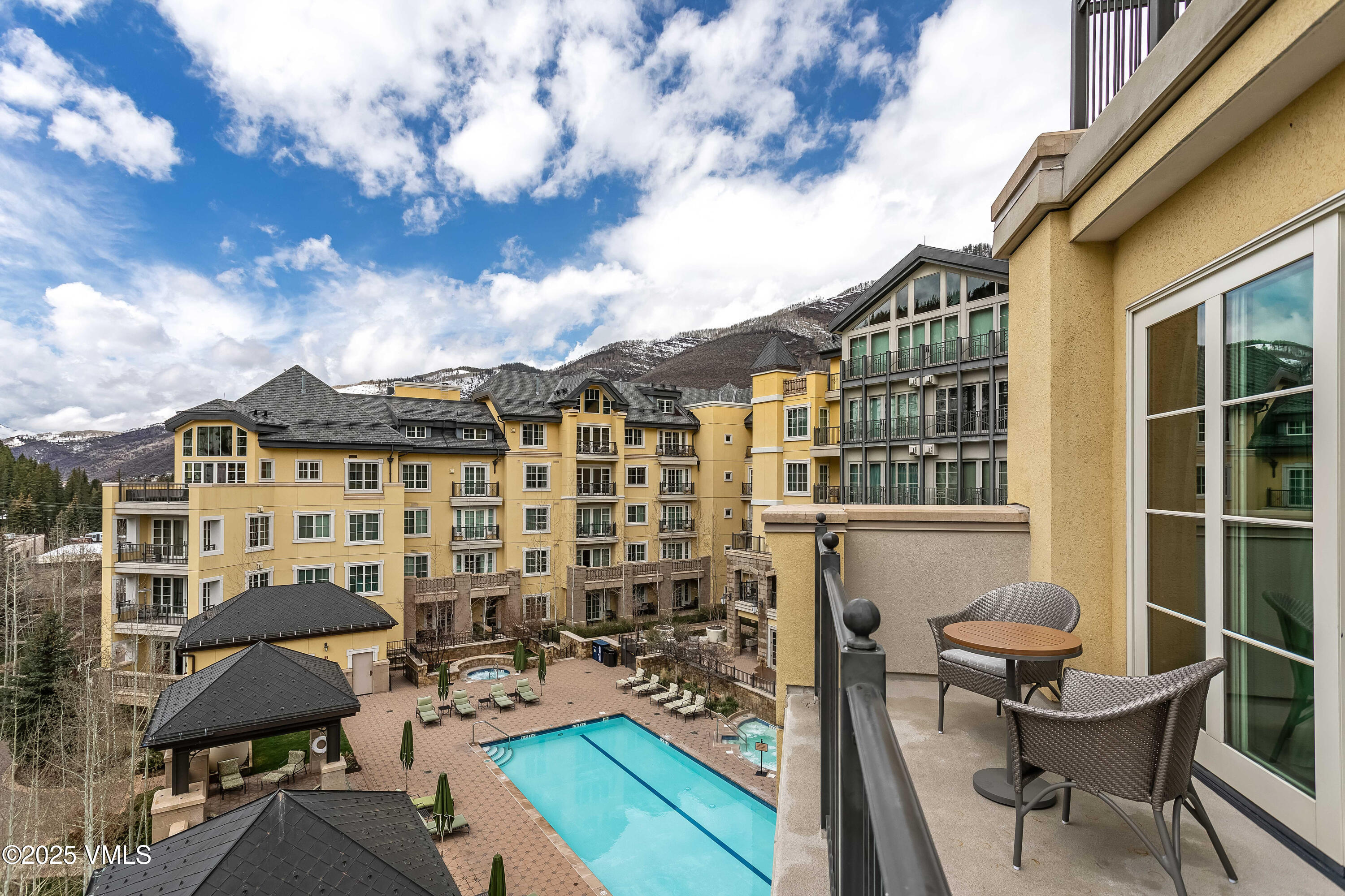 728 West Lionshead Circle, Unit F429 Vail, CO 81657 - Photo 24 of 25 a view of a chairs and table in the terrace