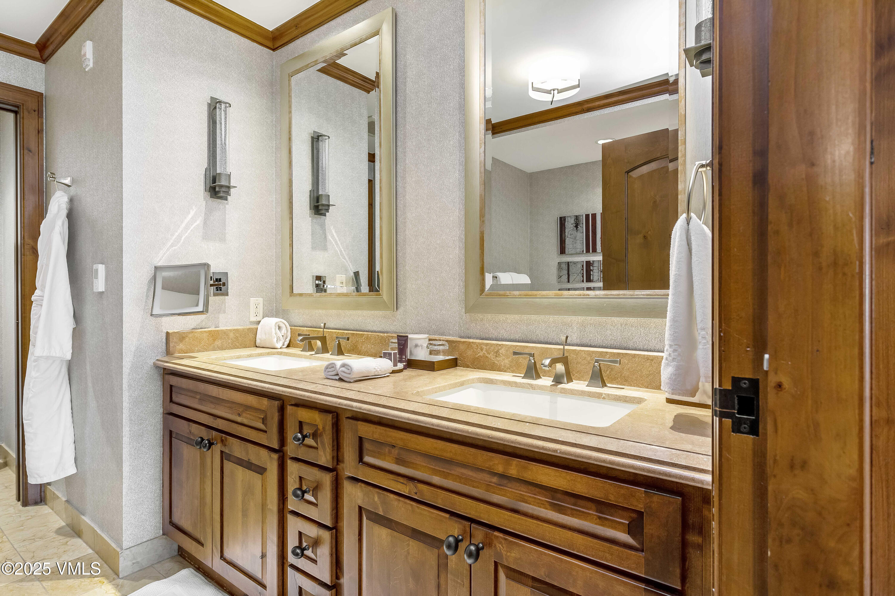728 West Lionshead Circle, Unit F429 Vail, CO 81657 - Photo 7 of 25 a bathroom with a sink and a mirror