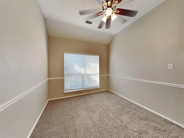 a backyard of a house with seating space
