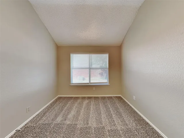a bathroom with a double vanity sink a toilet and a bathtub