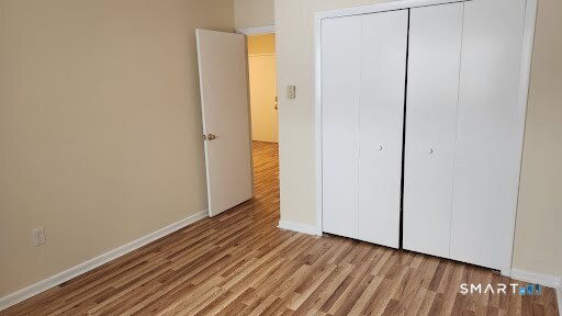 115 Short Beach Road, Unit 304 Stratford, CT 06615 - Photo 15 of 26 a view of a room with wooden floor