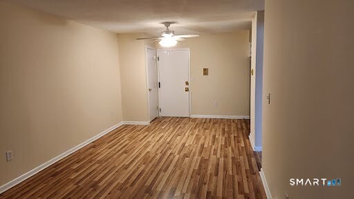 115 Short Beach Road, Unit 304 Stratford, CT 06615 - Photo 8 of 26 a view of a room with wooden floor