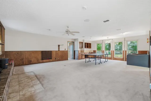 a view of a livingroom with furniture and a table