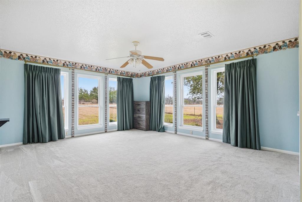776 County Road 3209 Wills Point, TX 75169 - Photo 24 of 40 a view of a room with closet and windows