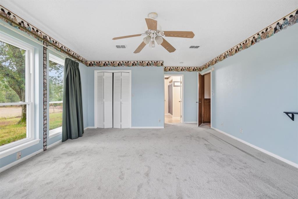776 County Road 3209 Wills Point, TX 75169 - Photo 25 of 40 a view of a livingroom with a ceiling fan and window