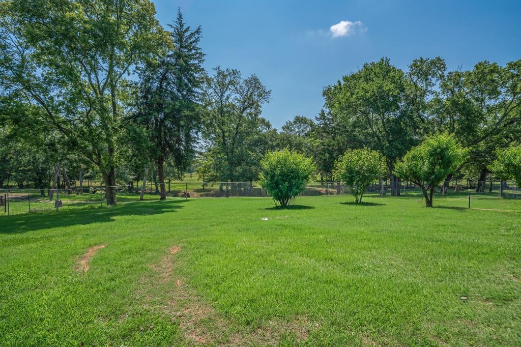 776 County Road 3209 Wills Point, TX 75169 - Photo 37 of 40 a view of field with trees in the background