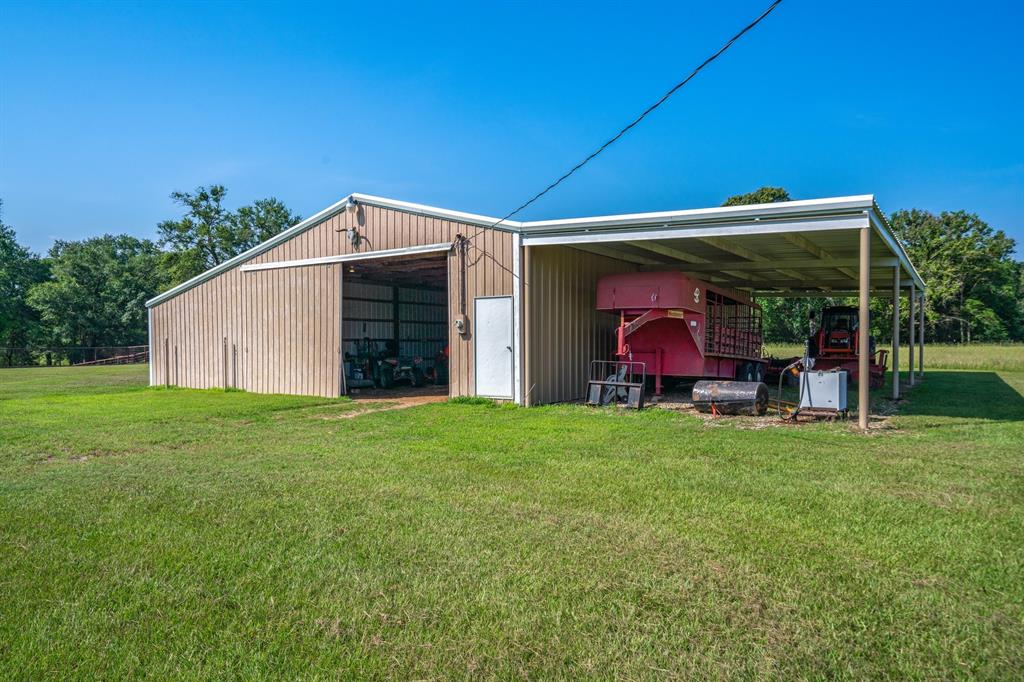 776 County Road 3209 Wills Point, TX 75169 - Photo 5 of 40 a view of a backyard with table and chairs and potted plants