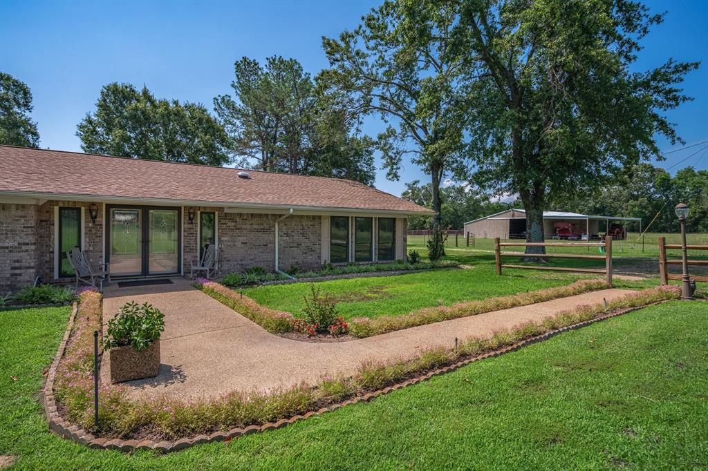 776 County Road 3209 Wills Point, TX 75169 - Photo 10 of 40 a view of a house with a backyard
