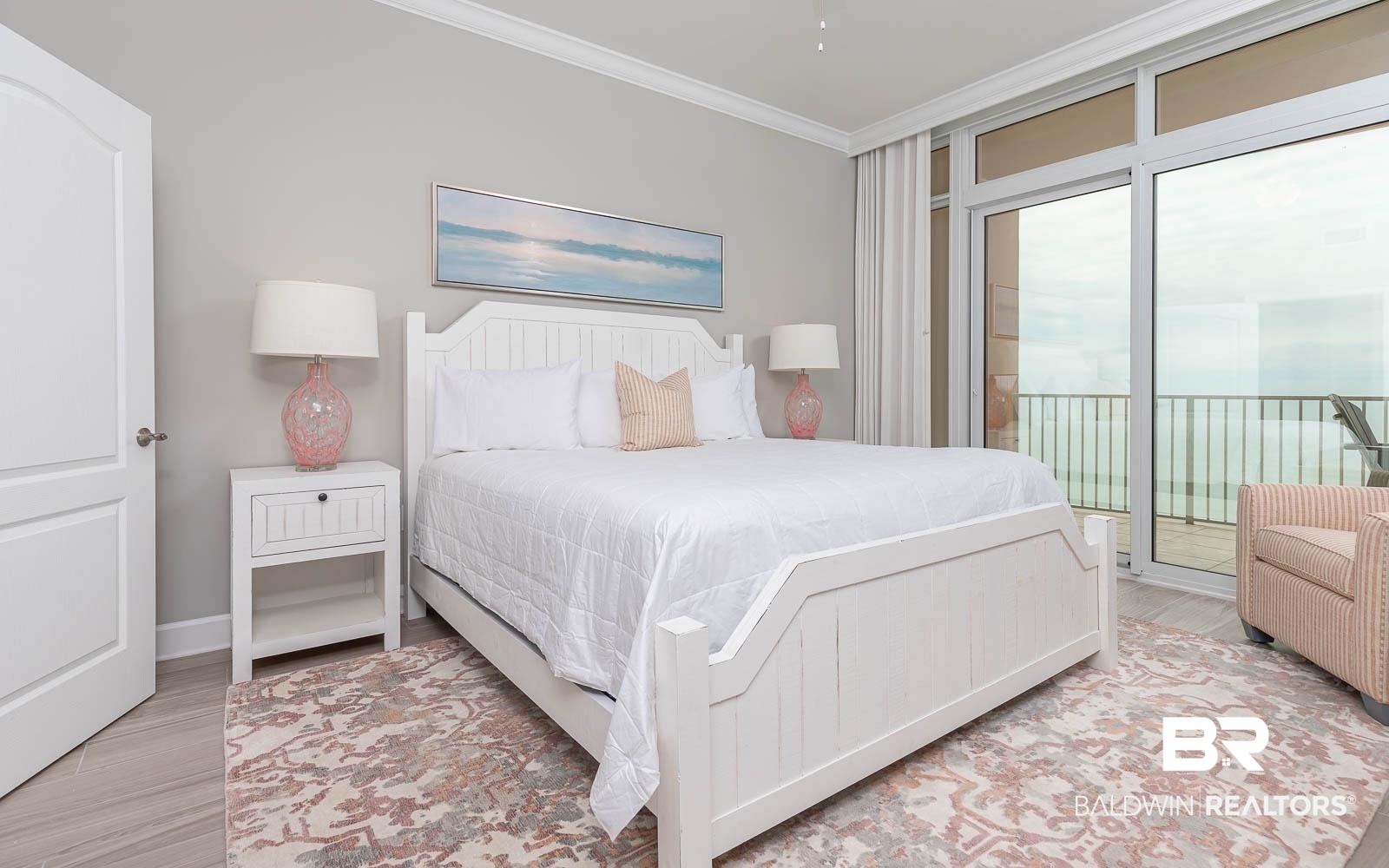 23008 Perdido Beach Boulevard, Unit 2003 Orange Beach, AL 36561 - Photo 9 of 35 Bedroom featuring light hardwood / wood-style floors, ornamental molding, multiple windows, and access to outside
