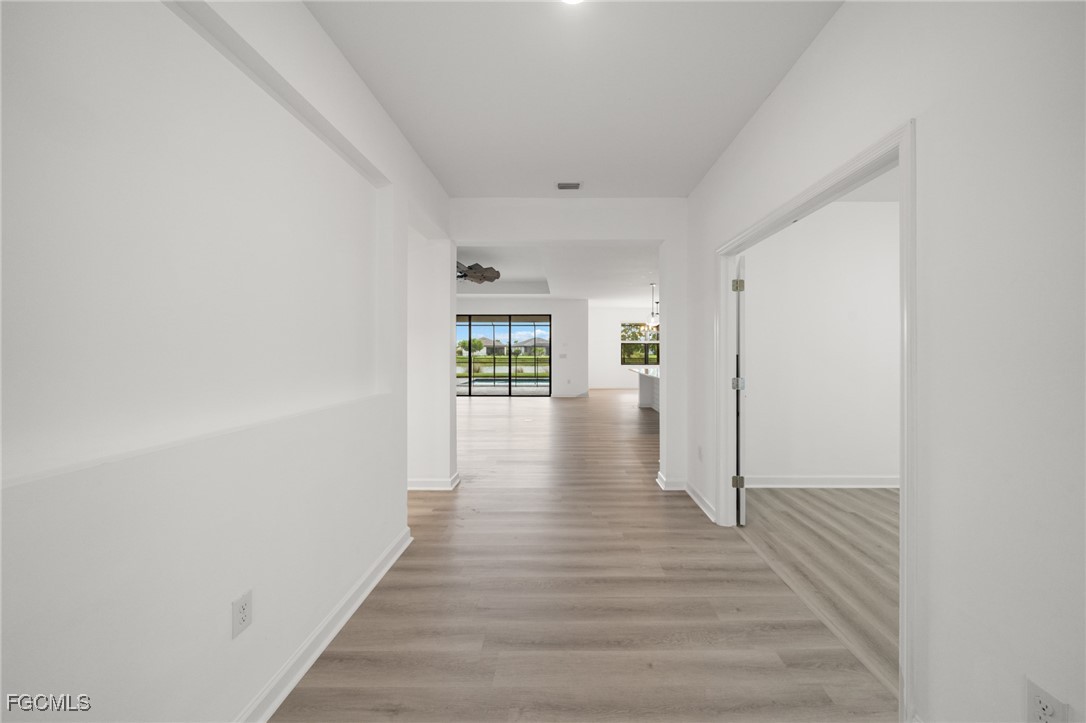 11559 Canopy Loop Fort Myers, FL 33913 - Photo 11 of 50 a view of an empty room with wooden floor