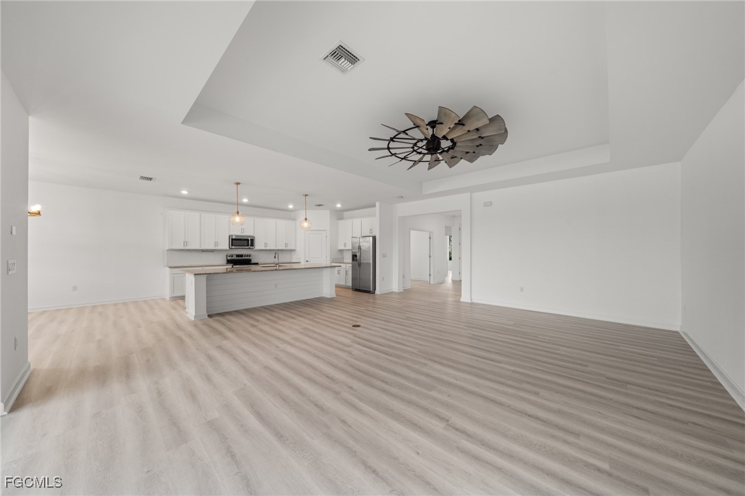 11559 Canopy Loop Fort Myers, FL 33913 - Photo 12 of 50 a view of kitchen refrigerator and microwave