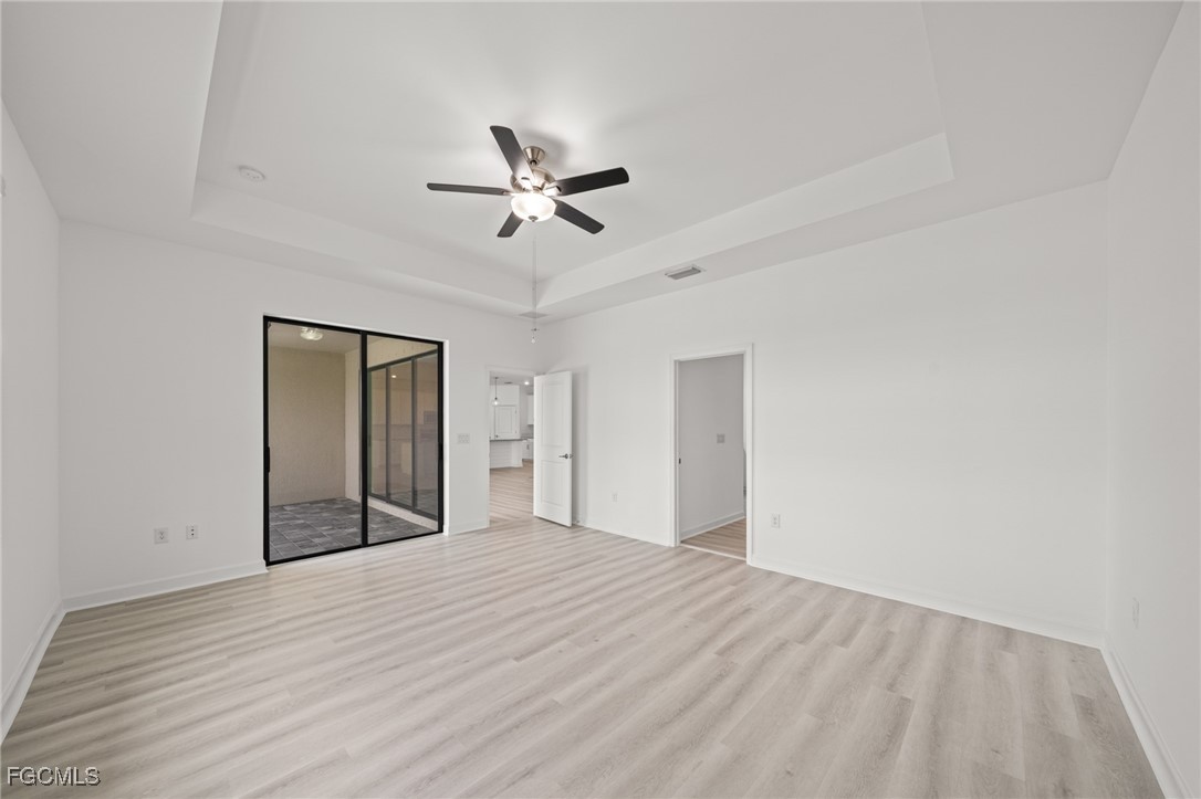 11559 Canopy Loop Fort Myers, FL 33913 - Photo 22 of 50 a view of empty room with a ceiling fan