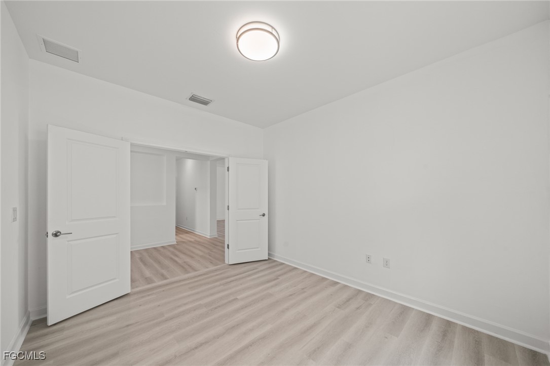 11559 Canopy Loop Fort Myers, FL 33913 - Photo 24 of 50 a view of room with wooden floor