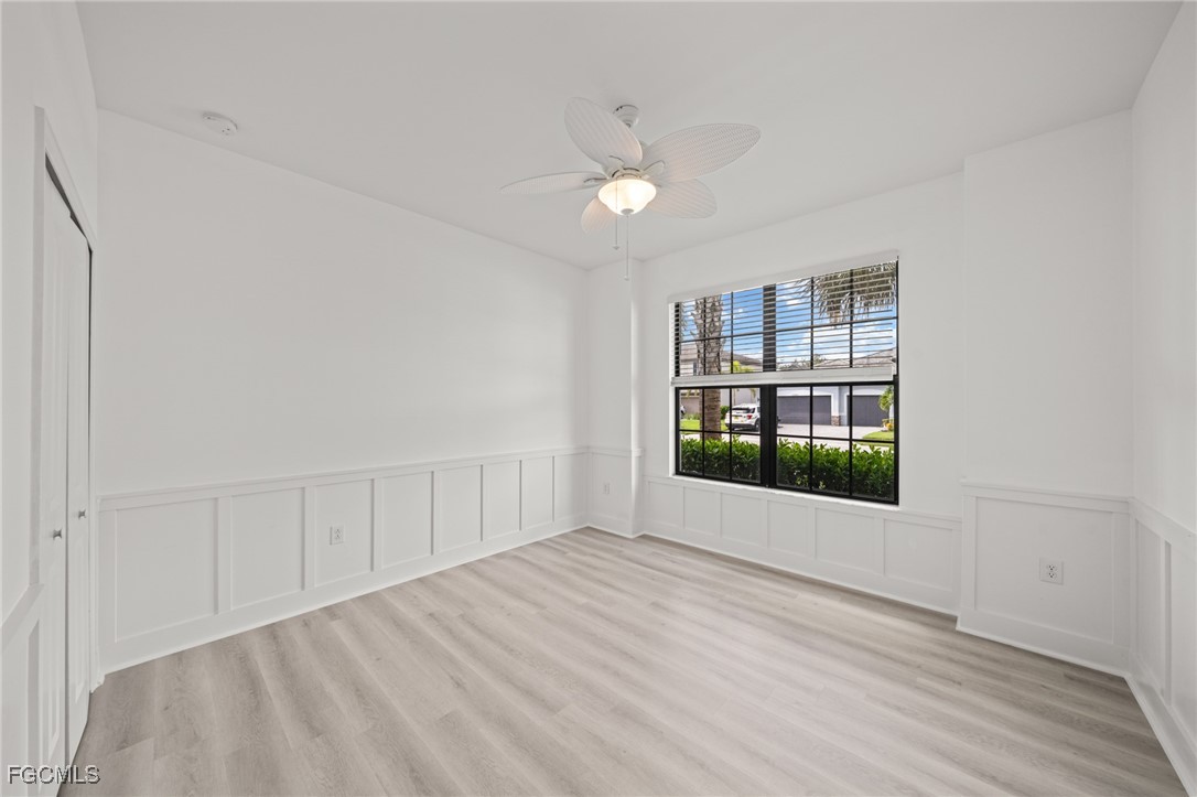 11559 Canopy Loop Fort Myers, FL 33913 - Photo 26 of 50 wooden floor in an empty room with a window