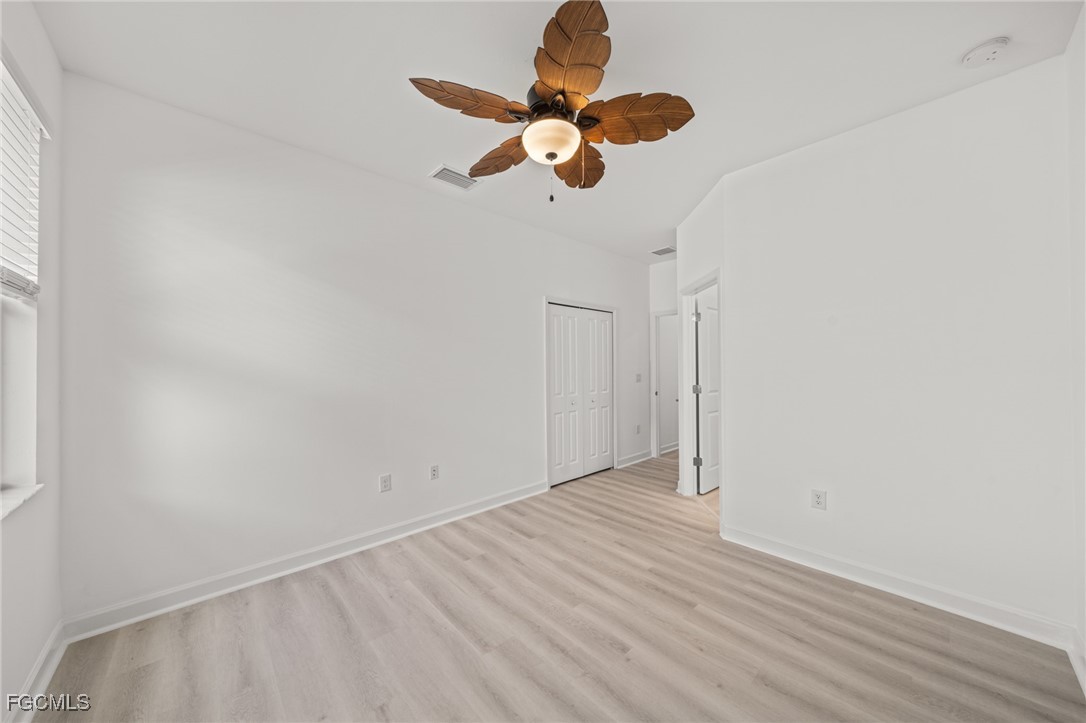 11559 Canopy Loop Fort Myers, FL 33913 - Photo 29 of 50 a view of an empty room with wooden floor