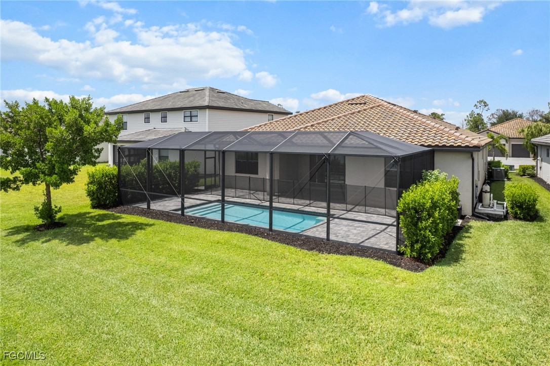 11559 Canopy Loop Fort Myers, FL 33913 - Photo 40 of 50 a view of a house with a yard and sitting area