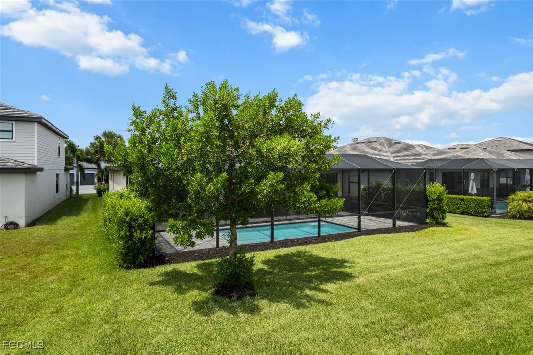 11559 Canopy Loop Fort Myers, FL 33913 - Photo 42 of 50 a view of a house with a backyard