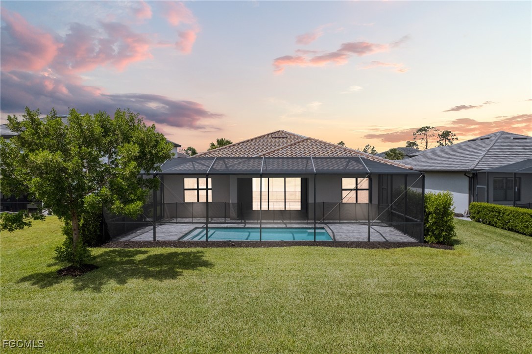 11559 Canopy Loop Fort Myers, FL 33913 - Photo 43 of 50 a front view of a house with a yard