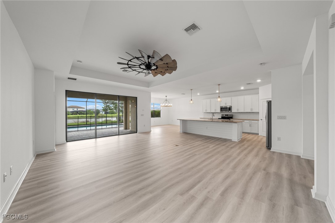 11559 Canopy Loop Fort Myers, FL 33913 - Photo 10 of 50 a view of kitchen with sink and wooden floor